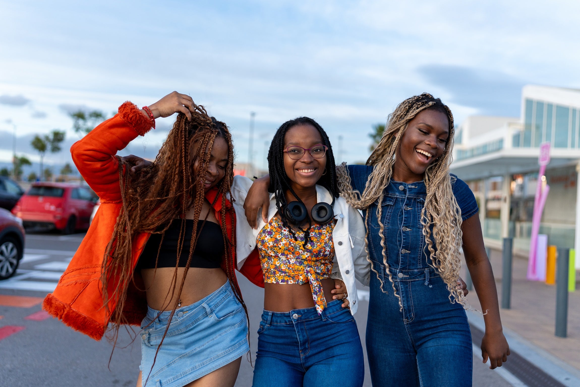 three-young-women-laughing-together-on-city-street-2026-03-26-23-59-50-utc.jpg